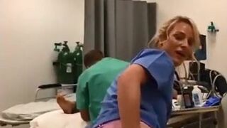 Nurse showing off in behind doctor & customer