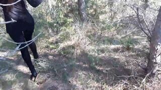 Walking on the Wood Wearing a Black Dress, Pantyhose and High Heels Ankle Boots