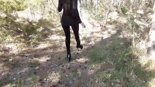 Walking on the Wood Wearing a Black Dress, Pantyhose and High Heels Ankle Boots