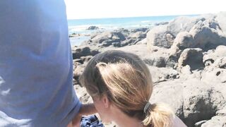 Exciting blowjob in public with people on the beach