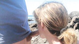 Exciting blowjob in public with people on the beach