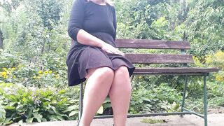 Lustful MILF pissing while sitting on a bench