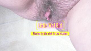 Pissing in the sink in the kitchen