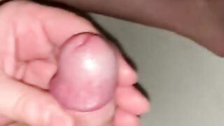 nude male does quick soft to hard handjob with uncut cock lots of cum