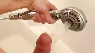 the guy washes the dick with a huge jet and cums