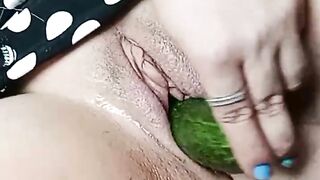 masturbating pussy with cucumber