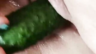 masturbating pussy with cucumber