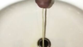 Pissing In The Bathroom Sink Using The Drain As A Target