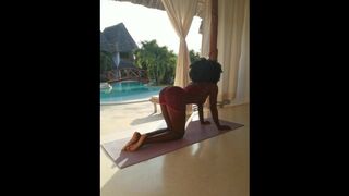 African yoga teacher showing her booty