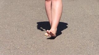 Bare feet on hot asphalt