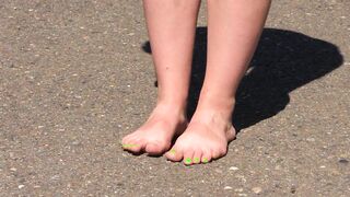 Bare feet on hot asphalt