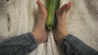 simulating footjob with an huge zucchini by a virgin cute girl