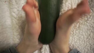 simulating footjob with an huge zucchini by a virgin cute girl