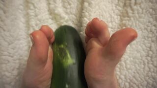 simulating footjob with an huge zucchini by a virgin cute girl