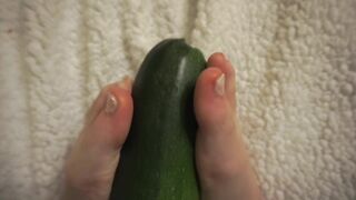 simulating footjob with an huge zucchini by a virgin cute girl