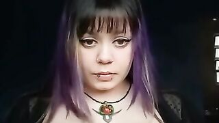 Goth girl with long nails wearing sheer lingerie plays with big tits