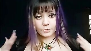 Goth girl with long nails wearing sheer lingerie plays with big tits