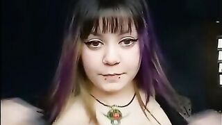 Goth girl with long nails wearing sheer lingerie plays with big tits