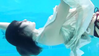 Underwater swimming classics bare feet Asian girl realise swimming costume