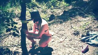 Beautiful slut totally naked in the forest sucking a dildo